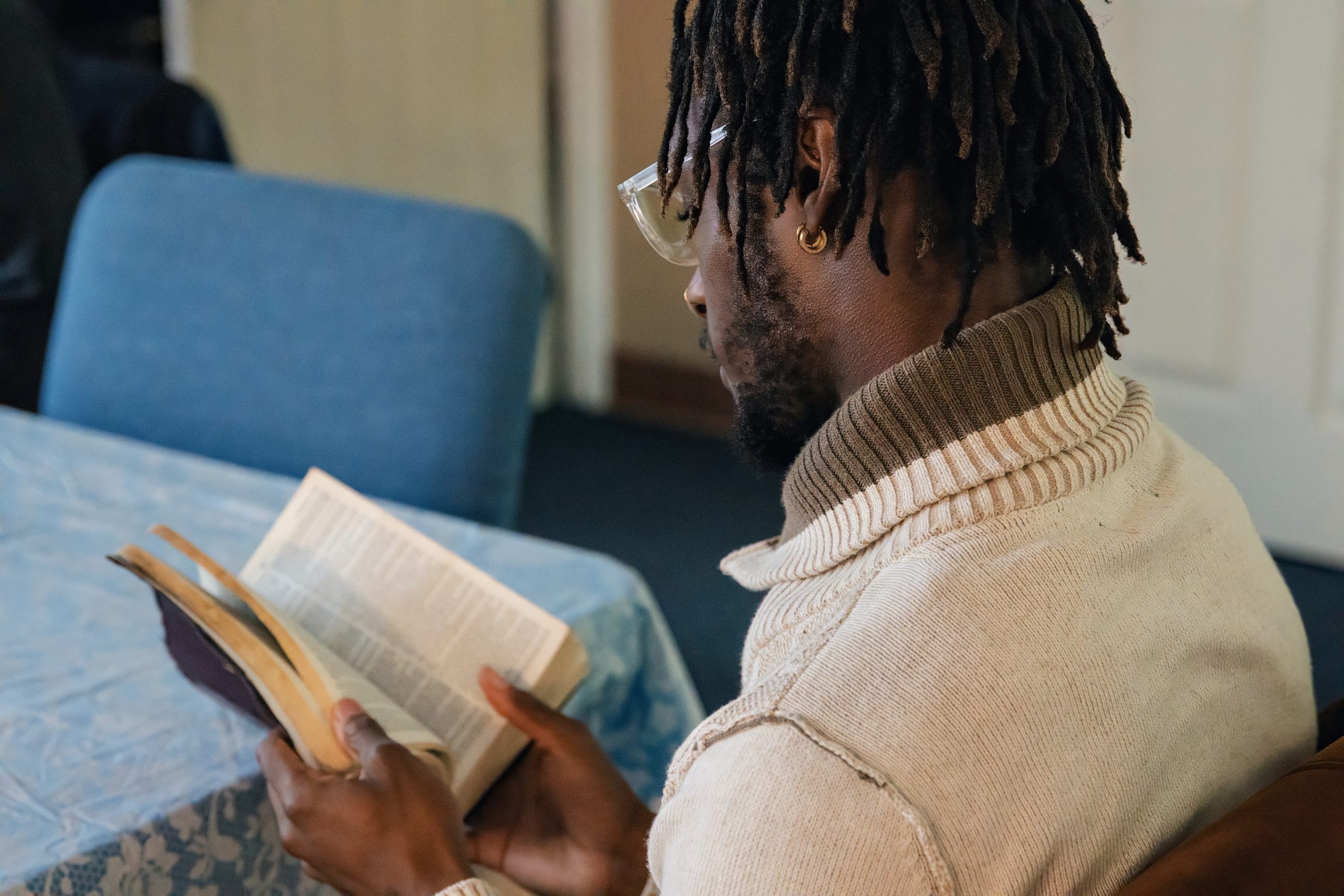 A young man reading his bible at a GMen event
